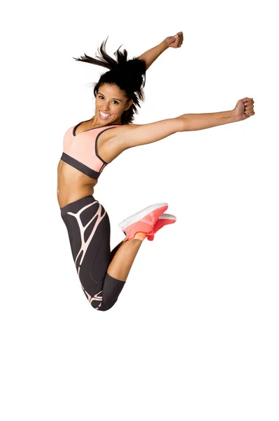 Young attractive hispanic fitness trainer woman jumping high excited and happy — Stock Photo, Image