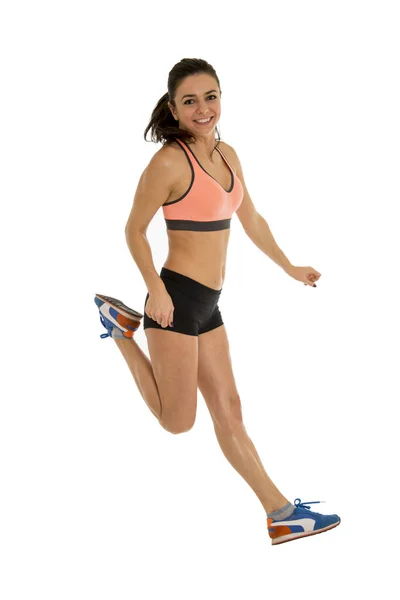 Jovem atraente treinador de fitness mulher saltando alta animado e feliz — Fotografia de Stock