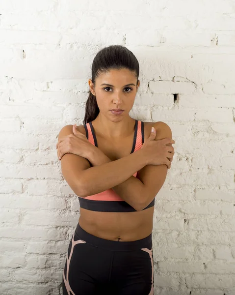 Latin sport woman posing in fierce and badass face expression with fit slim body — Stock Photo, Image