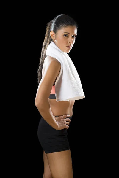 Sexy latin sport woman posing with towel in fierce and badass face expression — Stock Photo, Image