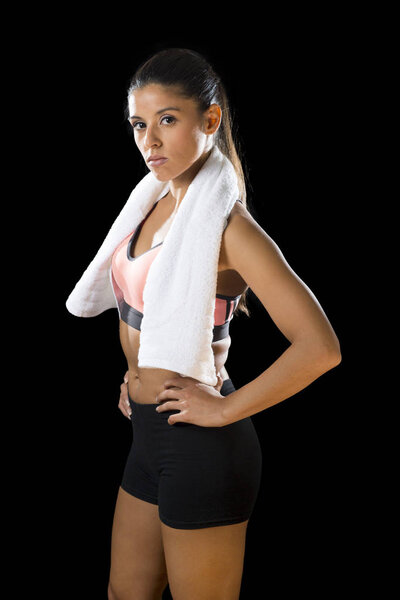  sexy latin sport woman posing with towel in fierce and badass face expression