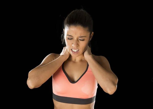 Hispanic fitness woman touching and grabbing her neck and upper back suffering cervical pain — Stock Photo, Image