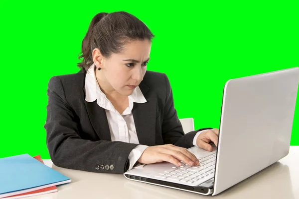 Businesswoman wearing business suit working on laptop computer green chroma key — Stock Photo, Image