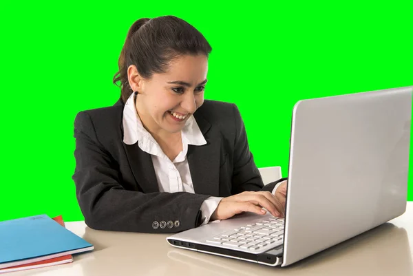 Business woman smiling happy working on laptop computer green chroma key background — стоковое фото