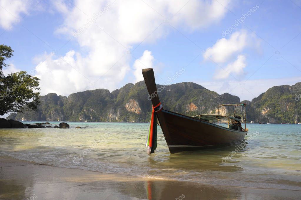  long tail boat on the beach at koh phi phi island in Thailand in Krabi