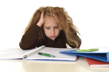  little schoolgirl sad and tired looking depressed suffering stress overwhelmed by load of homework clipart