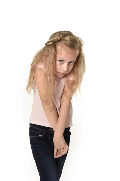 Sweet little child girl with beautiful blonde hair in casual clothes looking shy and timid as if scared — Stock Photo, Image