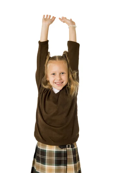 Young beautiful happy schoolgirl in pigtails and uniform smiling happy and excited having fun — Stock Photo, Image