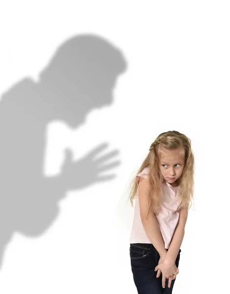 Father or teacher shadow screaming angry reproving young sweet little schoolgirl or daughter — Stock Photo, Image