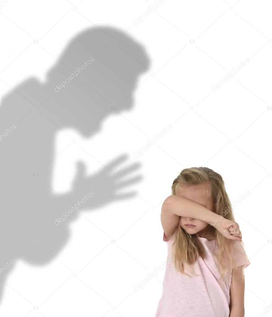 father or teacher shadow screaming angry reproving young sweet little schoolgirl or daughter 