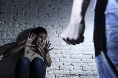 terrified woman attacked and abused by drunk husband in domestic violence concept clipart