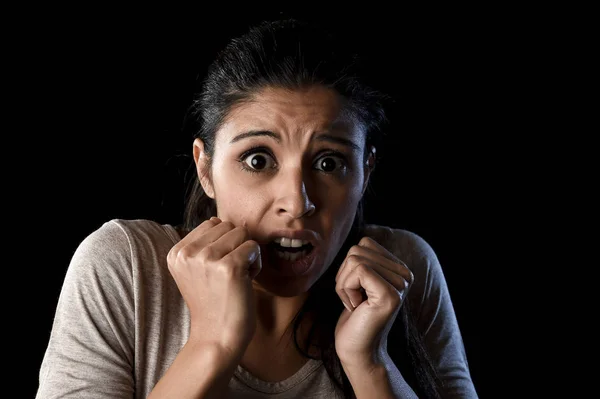 Terrorized and horrified  woman desperate and scared isolated on black — Stock Photo, Image