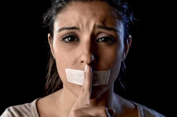 Close up portrait of young attractive woman with mouth and lips sealed in adhesive tape restrained — Stock Photo, Image