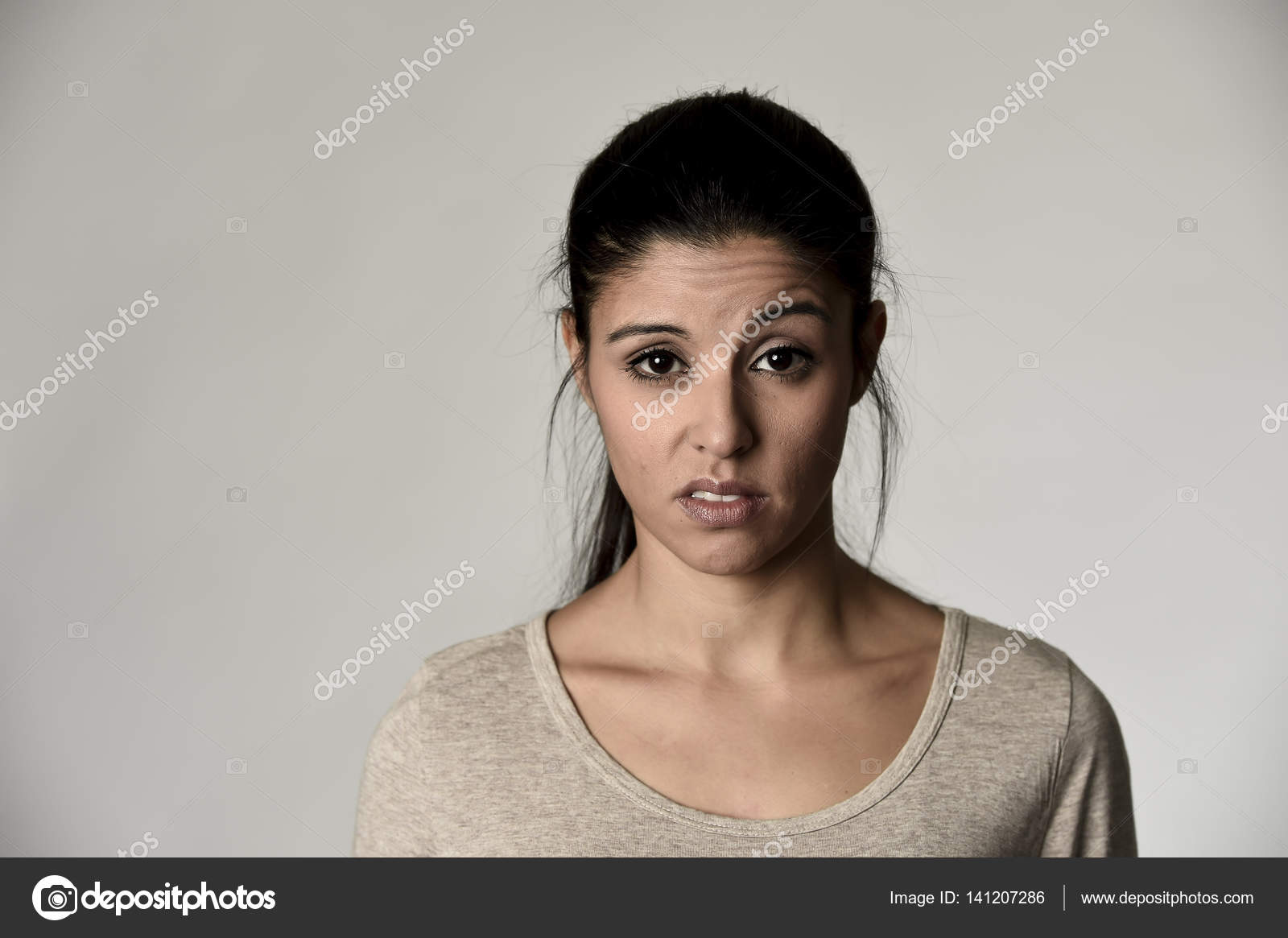 Beautiful arrogant and moody spanish woman showing negative feeling and