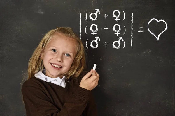 Schoolgirl in uniform holding chalk writing on blackboard standing for freedom of sexuality orientation — Stock Photo, Image