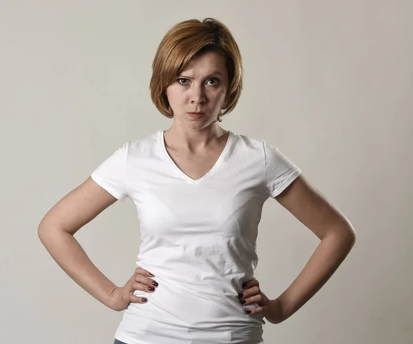 Young attractive and moody woman posing alone angry and upset in bad mood and rage face — Stock Photo, Image