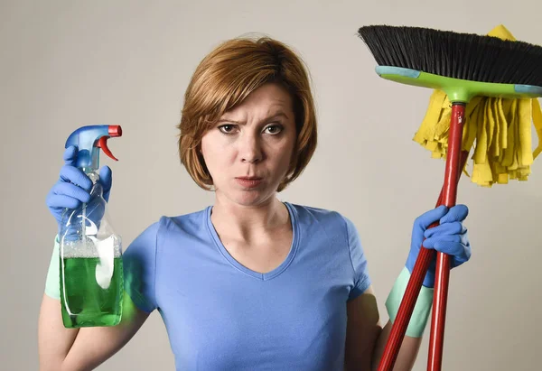 Housewife in washing rubber gloves carrying cleaning spray bottl — Stock Photo, Image
