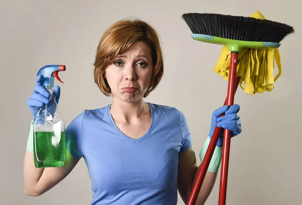 Housewife in washing rubber gloves carrying cleaning spray bottl — Stock Photo, Image