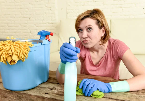 Happy and cheerful woman or housewife cleaning living room table and furniture with cloth — Stock Photo, Image