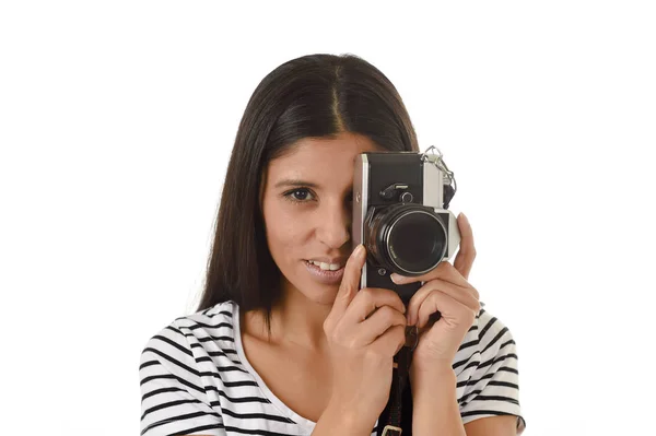 Latin woman taking pictures looking through the viewfinder of an old cool retro vintage photo camera — Stock Photo, Image