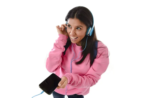 Young woman or student girl with mobile phone listening to music headphones singing and dancing — Stock Photo, Image