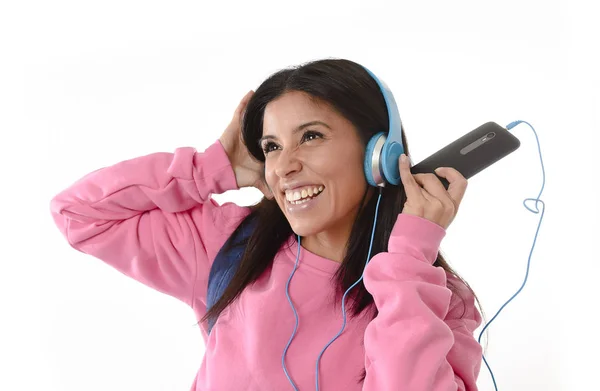 Young woman or student girl with mobile phone listening to music headphones singing and dancing — Stock Photo, Image