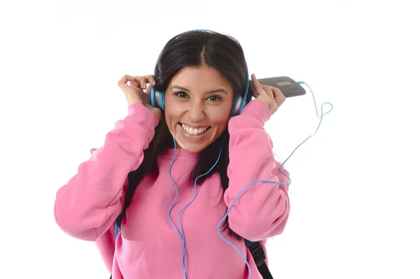 Young woman or student girl with mobile phone listening to music headphones singing and dancing — Stock Photo, Image