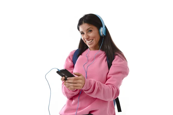 Young woman or student girl with mobile phone listening to music headphones singing and dancing — Stock Photo, Image