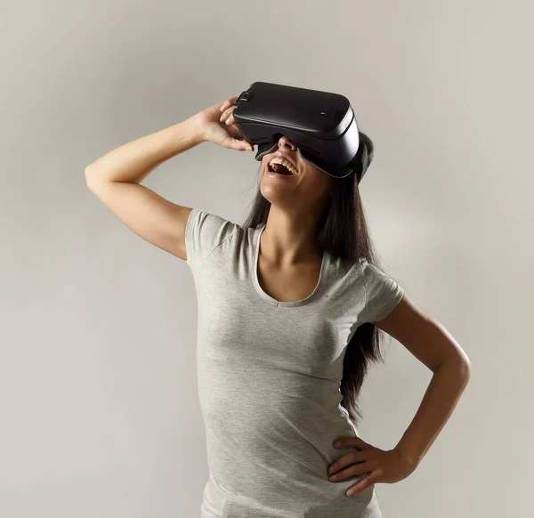 attractive happy woman excited using 3d goggles watching 360 virtual reality vision enjoying