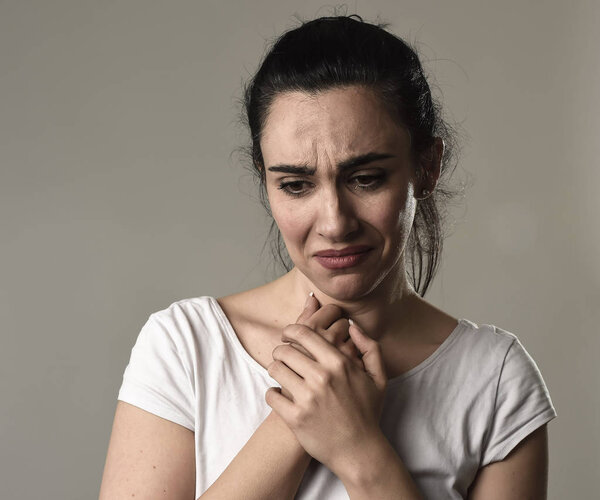 beautiful and sad woman crying desperate and depressed with tears on her eyes suffering pain