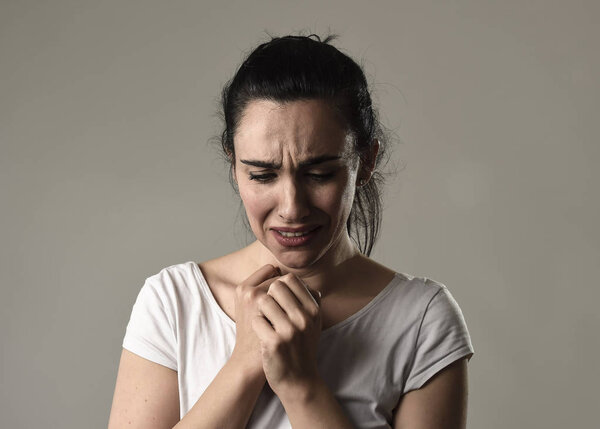 beautiful and sad woman crying desperate and depressed with tears on her eyes suffering pain