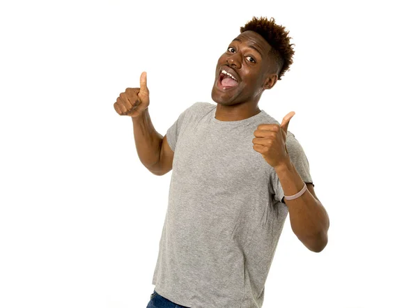 Joven amistoso y feliz afro americano hombre sonriendo emocionado y posando fresco y alegre aislado —  Fotos de Stock