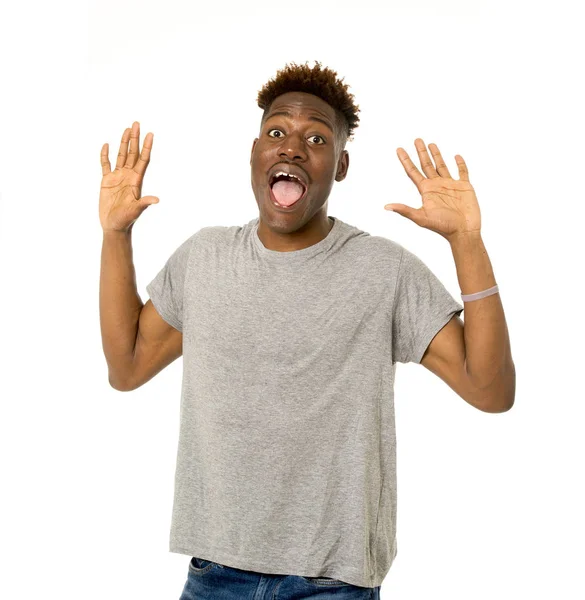 Joven amistoso y feliz afro americano hombre sonriendo emocionado y posando fresco y alegre aislado —  Fotos de Stock