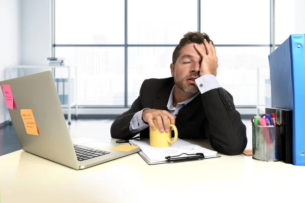 Exhausted businessman suffering stress at office computer desk — Stock Photo, Image