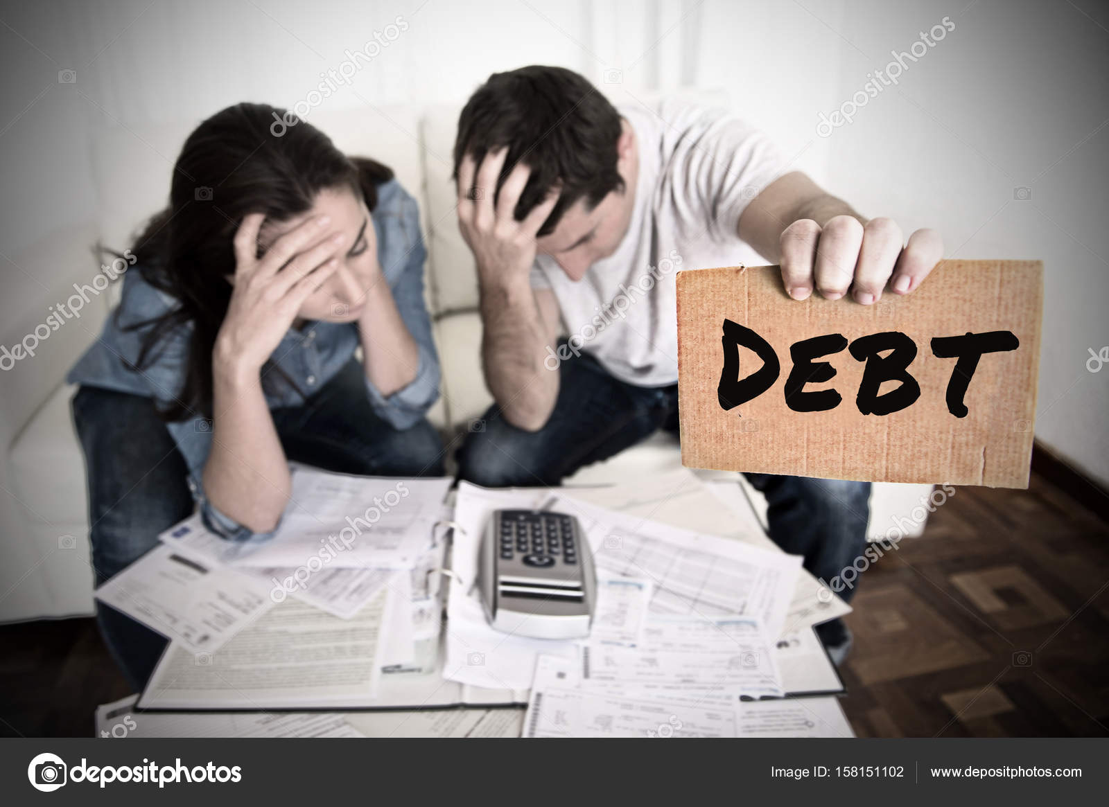 Couple worried need help in stress at home couch accounting debt bills