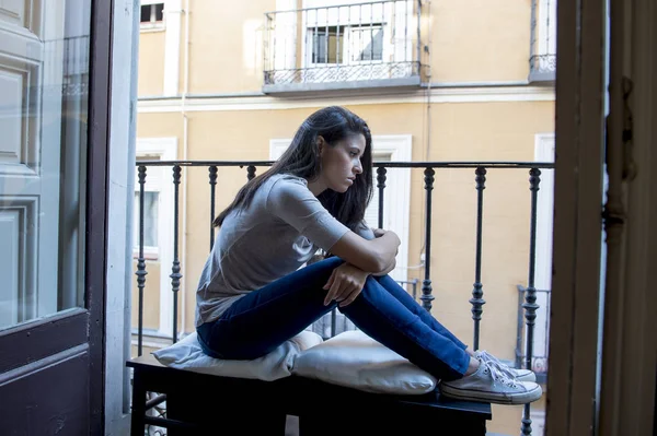 Desperate sad Latin woman at home balcony looking devastated and depressed suffering depression — Stock Photo, Image