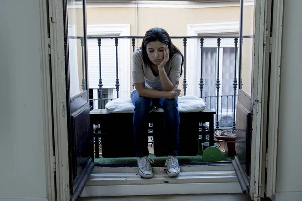 Desperate sad Latin woman at home balcony looking devastated and depressed suffering depression — Stock Photo, Image