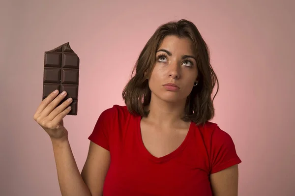 Young beautiful happy and excited woman holding big chocolate ba — Stock Photo, Image