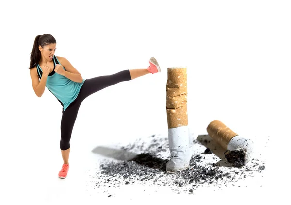 Furious latin sport woman in fight combat kick attacking angry against cigarette butt in stop and anti smoking concept — Stock Photo, Image