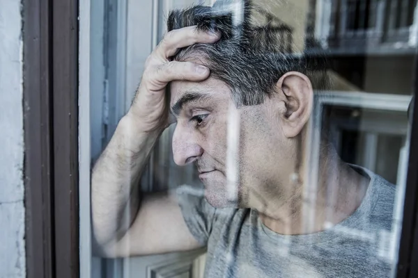 Close up portrait of sad and depression man looking through w — Stok Foto