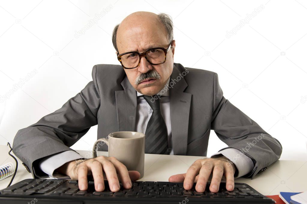 senior mature busy business man with bald head on his 60s working stressed and frustrated at office computer laptop desk looking angry