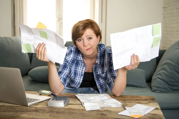 Desperate woman banking and accounting home monthly and credit card expenses with computer laptop doing paperwork — Stock Photo, Image