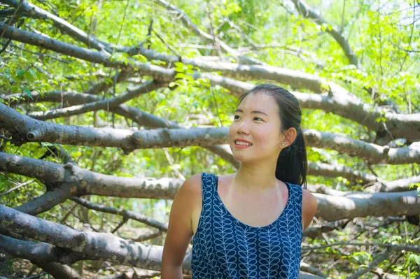 Young pretty and happy Asian Chinese woman taking a walk excursion trip on tropical mountain enjoying nature smiling cheerful in holiday — Stock Photo, Image