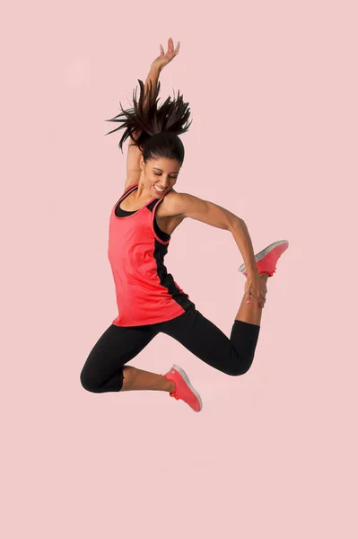 Young happy and beautiful girl jumping crazy excited in female s — Stock Photo, Image