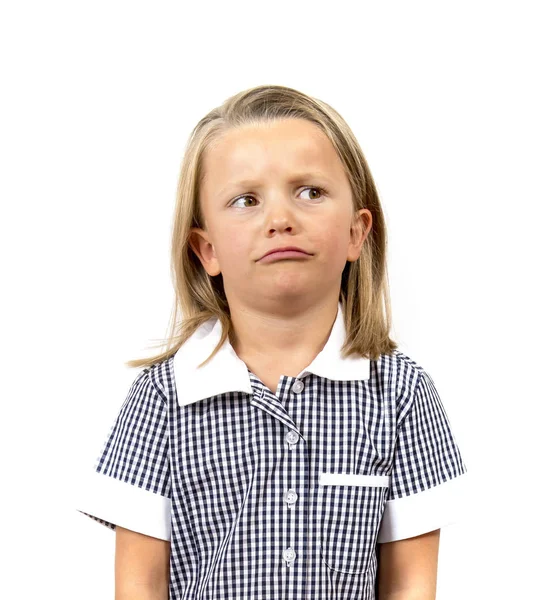 Jonge mooie en humeurig schoolmeisje in uniform op zoek moe verveeld en boos in gefrustreerd gezicht expressie geïsoleerd op een witte achtergrond in het onderwijs — Stockfoto