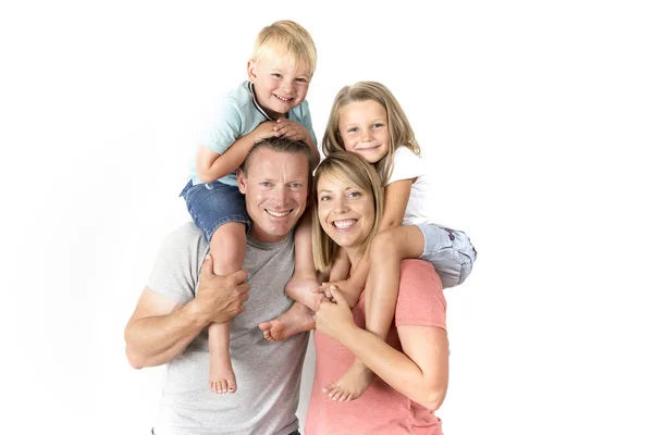 Happy and beautiful American family with husband and wife carrying on their back little son and lovely young daughter in love parents and children — Stock Photo, Image