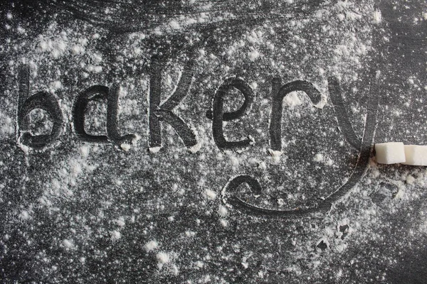 Слово Пекарня Написано Темном Фоне Камнем Мучном Сахарном Камне Пространством — стоковое фото