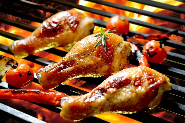 Grilled chicken leg on the flaming grill — Stock Photo, Image