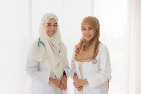 Portrait Two Muslim Female Doctor Working Office Smiling Camer — Stok fotoğraf