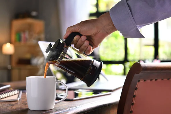 Hand Pouring Steaming Coffee Cup Work Desk Work Home — Stock Photo, Image